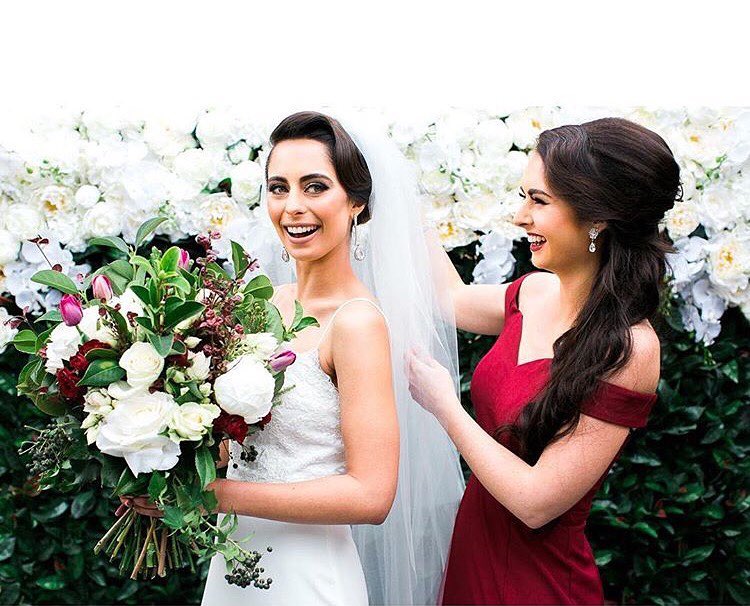white fake flower wall for wedding