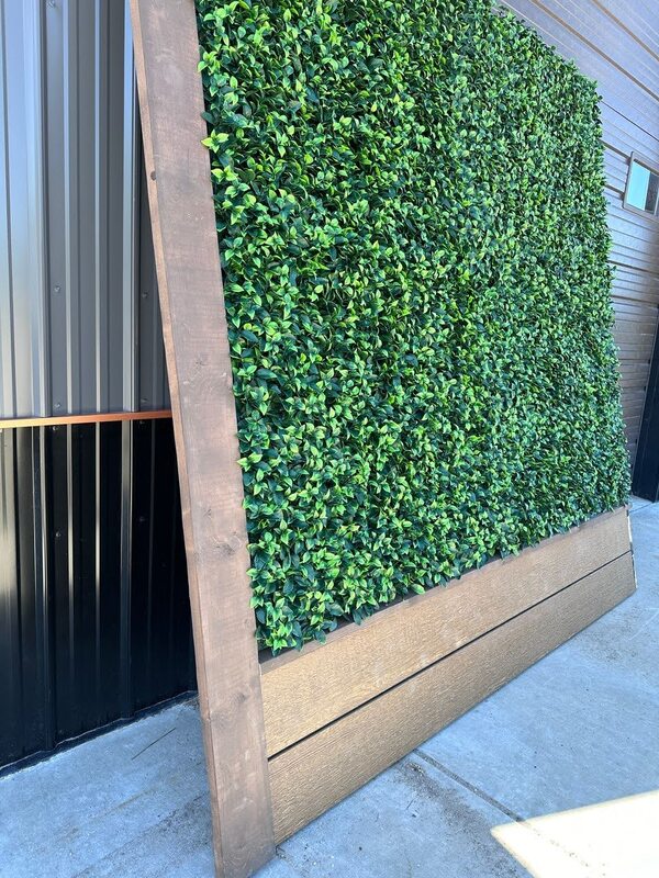 artificial green wall panel on wooden base