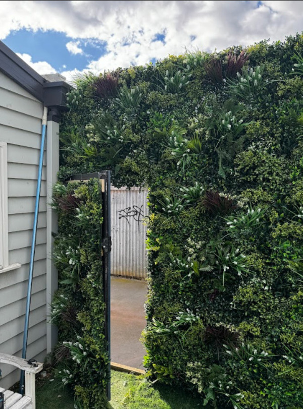 green wall panels on fence door