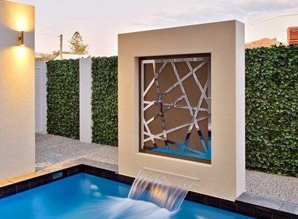 Artificial Ivy Hedge Screen Installed Near A Pool