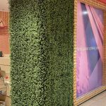 Artificial boxwood hedge panel used for a retail shop display design