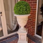 Artificial topiary ball in urn