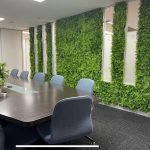 An office wall fit out with an unreal looking hedge