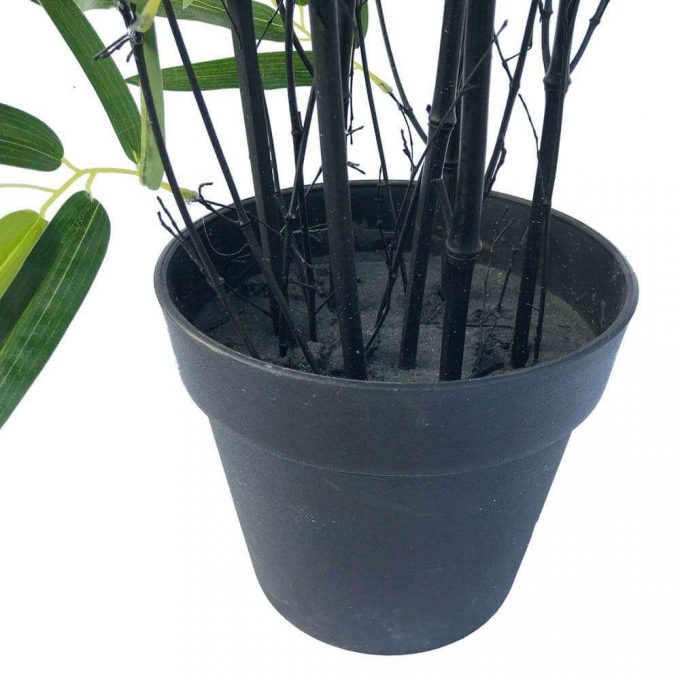 pot of an artificial bamboo plant with black trunks