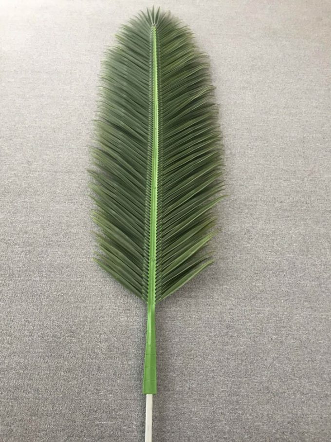 Artificial plastic leaf of a palm tree