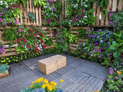 Maintaining a vertical garden - vertical boxed garden made with crates and flowers