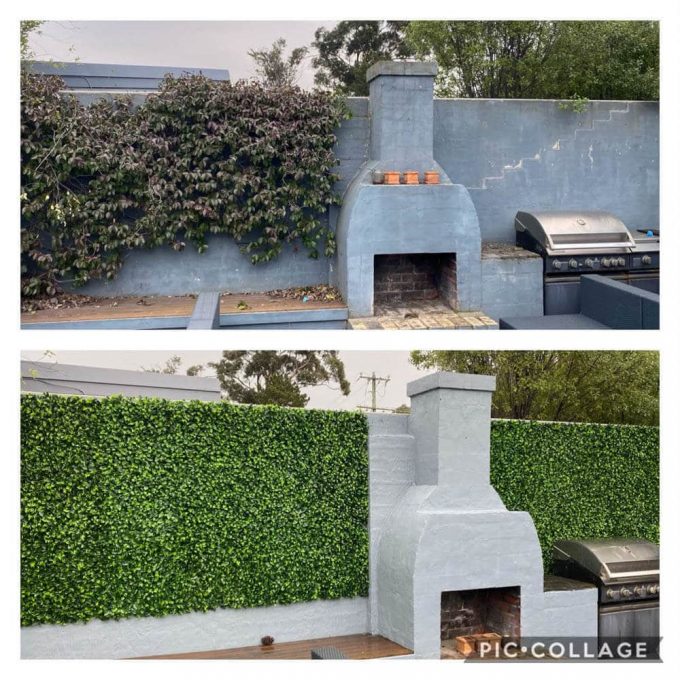 fake hedge panels installed onto a brick wall