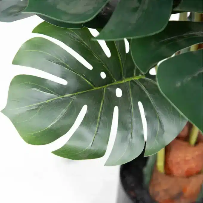 Evergreen artificial Monstera, capturing the essence of the jungle in a pot.